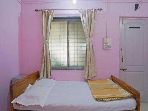 Ліжко або ліжка в номері MM Cottage Near Mandir Road
