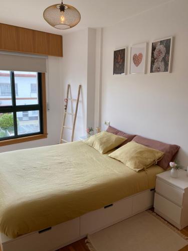 a bedroom with a large bed in a room at Luky Miño in Miño