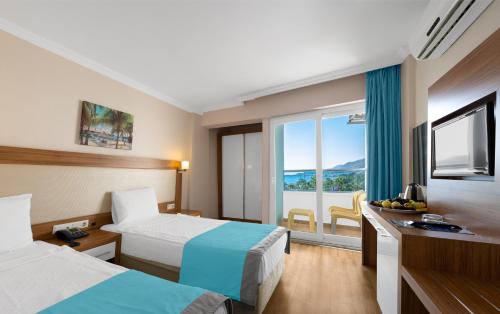 Ένα ή περισσότερα κρεβάτια σε δωμάτιο στο Mesut Hotel