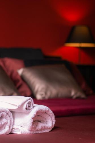 a close up of a towel on the floor next to a bed at Affittacamere B&B Carella in Palermo