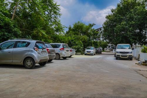 a group of cars parked on the side of a street at Regenta Inn Vadodara, 500m from Railway Station in Vadodara