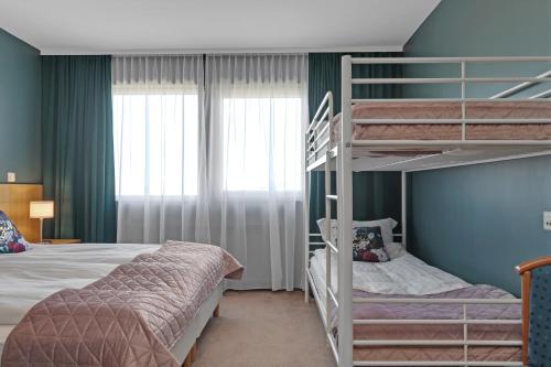 Postel nebo postele na pokoji v ubytování Hotel Kvika