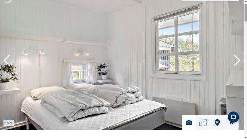 Ein Bett oder Betten in einem Zimmer der Unterkunft Nordjutland - Kattegat