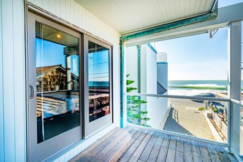 an open balcony with a view of the ocean at Beach Villa Home - Walk to Beaches Trails Restaurants Activities & more in Half Moon Bay