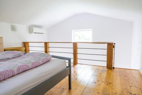 a bedroom with a bed and a desk at Oleander in Portorož
