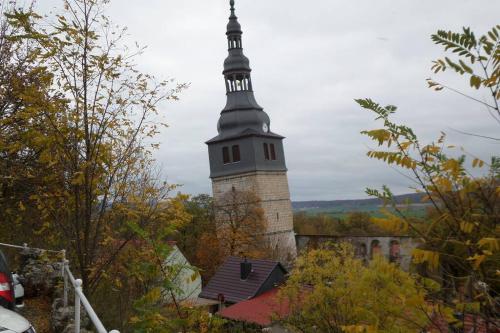 a tall building with a steeple on top of it at Apartment Am Kurpark in Bad Frankenhausen