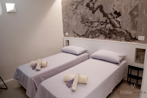 Ένα ή περισσότερα κρεβάτια σε δωμάτιο στο Doña Marìa - Holiday Home