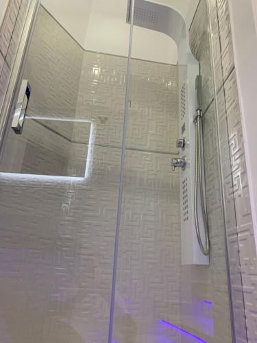 a shower with a glass door in a bathroom at B&B Vittorio Emanuele in Licata
