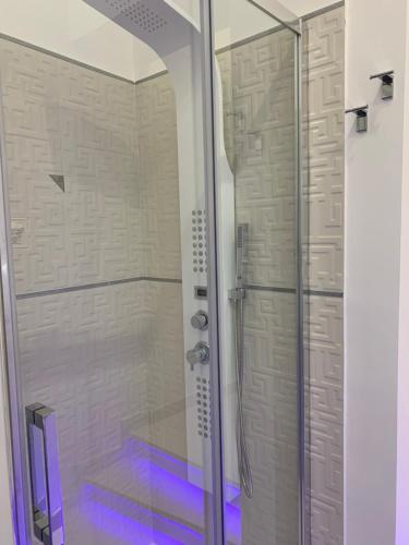 a shower with a glass door in a bathroom at B&B Vittorio Emanuele in Licata