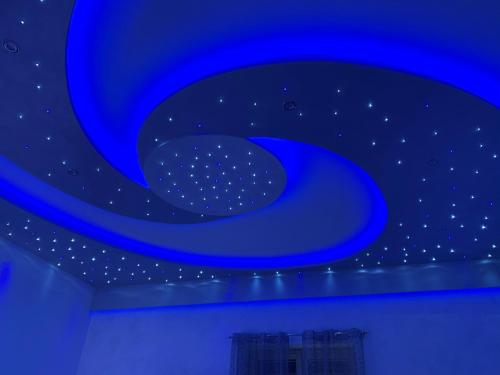 a blue ceiling with stars in a room at B&B Vittorio Emanuele in Licata