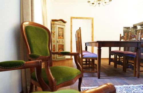 a dining room with a table and chairs at Premium Residences Rauris incl Sommercard in Rauris