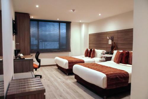 Кровать или кровати в номере Isa Victory Hotel Boutique