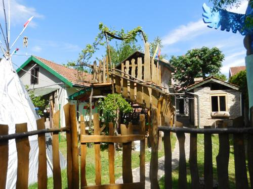 a wooden fence in front of a house at Villa Anna in Palić