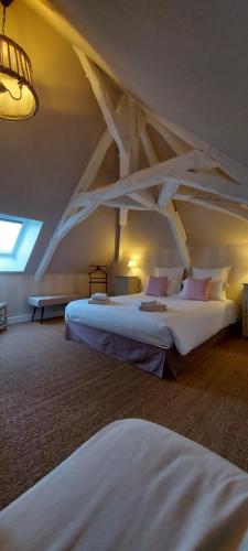 a bedroom with a bed and a night stand at Le Clos des Bories in Sarlat-la-Canéda