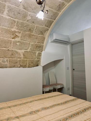 Un pat sau paturi într-o cameră la Dimora Sportelli