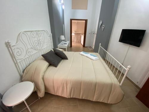Postel nebo postele na pokoji v ubytování IL CAMPANILE APARTMENTS