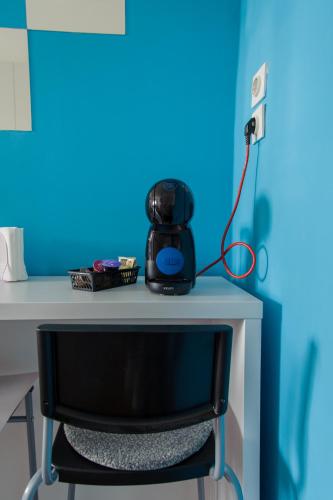 a black appliance sitting on top of a desk at Cozy river view apartment in Karlovac