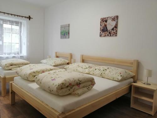 Postel nebo postele na pokoji v ubytování Apartmány 62