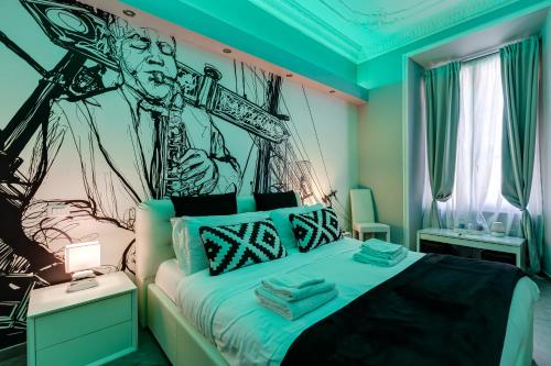 Ein Bett oder Betten in einem Zimmer der Unterkunft Maison Degli Artisti Suites