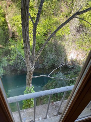 a view of a river from a window at MOULIN DE L'OULETTE in Soubès