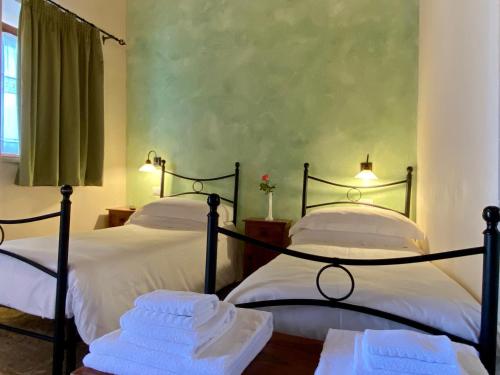 Postel nebo postele na pokoji v ubytování Mastro Vanni - Urban Masseria