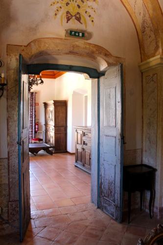 an entrance to a room with an open door at Hotel de Charme Capela das Artes in Armação de Pêra