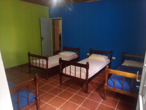 Ein Bett oder Betten in einem Zimmer der Unterkunft Hospedaria do canella