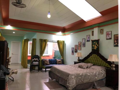 a bedroom with a large bed in a room at Villa 301 B&B in Baclayon