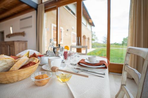 a table with a basket of bread on a table at Agriturismo Ai Dossi in Verona