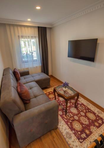 a living room with a couch and a table at Duru Sultanahmet Apart & Suites in Istanbul