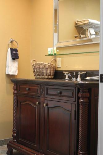 a bathroom vanity with a sink and a mirror at The Drift Inn in Rupert