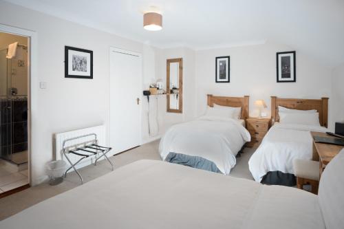 Ένα ή περισσότερα κρεβάτια σε δωμάτιο στο Woodside Lodge accomodation