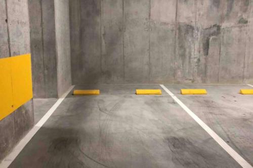an empty room with yellow barriers on the floor at Amazing views SJO, Cozy, Equipped. 24/7 Concierge in San José