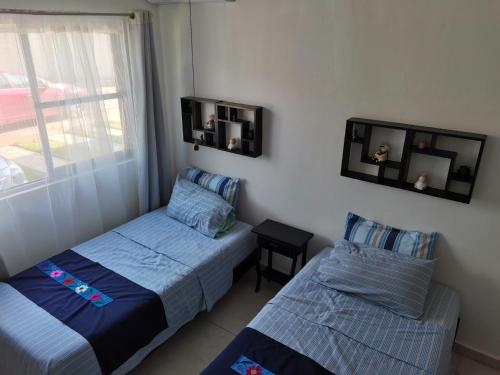 A bed or beds in a room at Casa MEXH Veredas - Ideal para familias, vacaciones o homeoffice