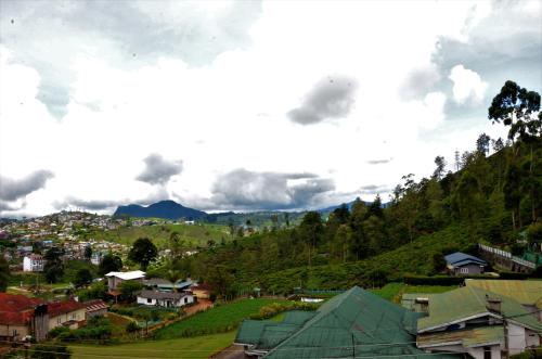 a view of a village with a mountain at Heaven Seven Nuwara Eliya in Nuwara Eliya