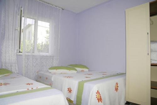 Voodi või voodid majutusasutuse Dogan Pension toas