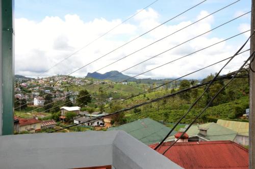 a view of a city from a balcony at Heaven Seven Nuwara Eliya in Nuwara Eliya