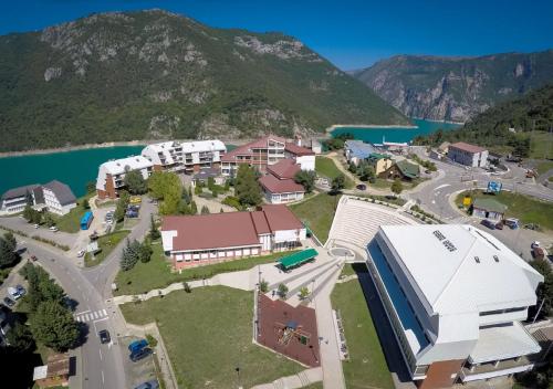 an aerial view of a town with a mountain at Apartments Ravno in Pluzine