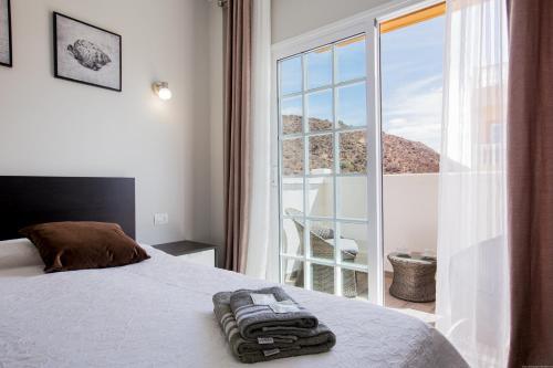 Ένα ή περισσότερα κρεβάτια σε δωμάτιο στο Palm Mar de LUX A32