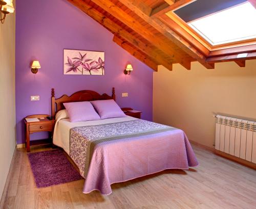 Postel nebo postele na pokoji v ubytování Hotel L´Alloru