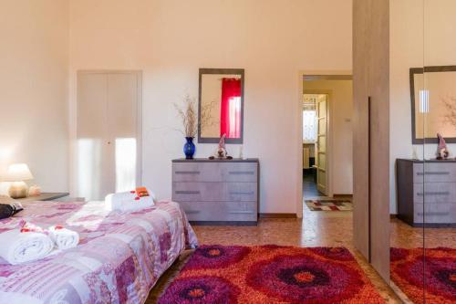 Postel nebo postele na pokoji v ubytování GARDALAND Residenza le Rose! 120 m2