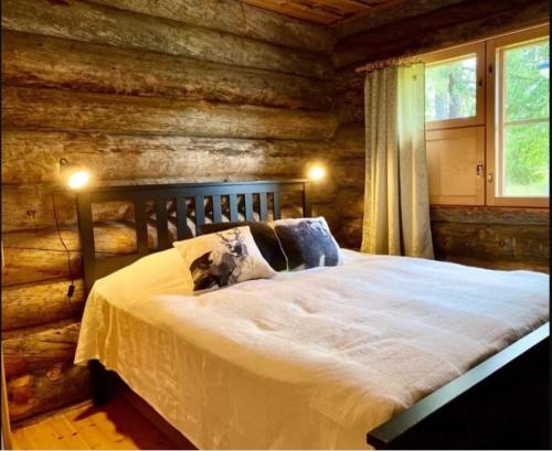 Säng eller sängar i ett rum på Lumomaa Ruka