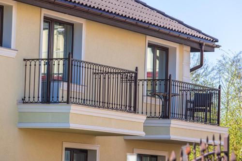 a building with balconies on the side of it at Sakura_INN Palanga in Palanga