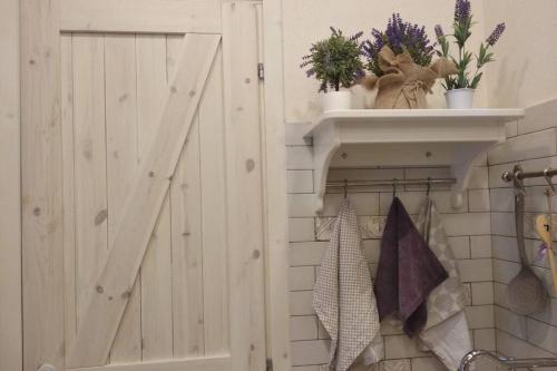a bathroom with a closet with a sliding door at Serenity Cottage Feriolo in Baveno