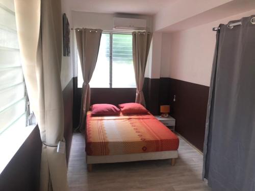 Кровать или кровати в номере Hibiscus