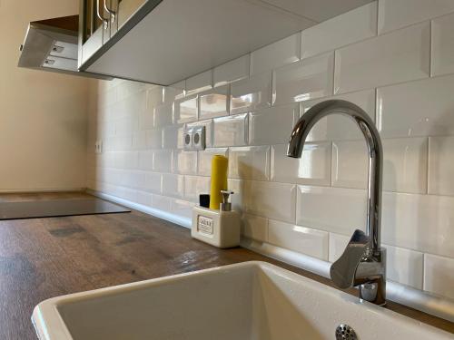 a kitchen sink with a faucet in a kitchen at Casa Dunia in Valderrobres