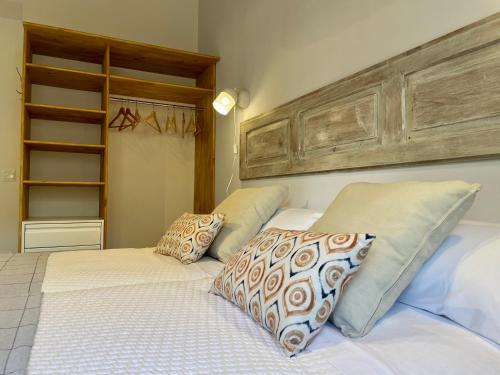 a bedroom with two beds with pillows on them at Casa Dunia in Valderrobres