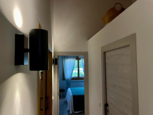 a room with a bedroom with a bed and a door at Casa Dunia in Valderrobres