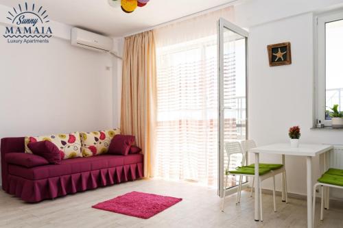 Et opholdsområde på Astoria Apartment by Sunny Mamaia