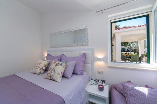 Een bed of bedden in een kamer bij Apartman Stipić 1